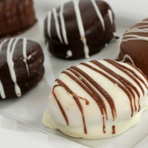Chocolate Dipped Alfajor Cookies - Azucar Bakery